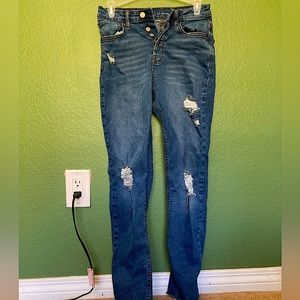 High-rise blue ripped jeans